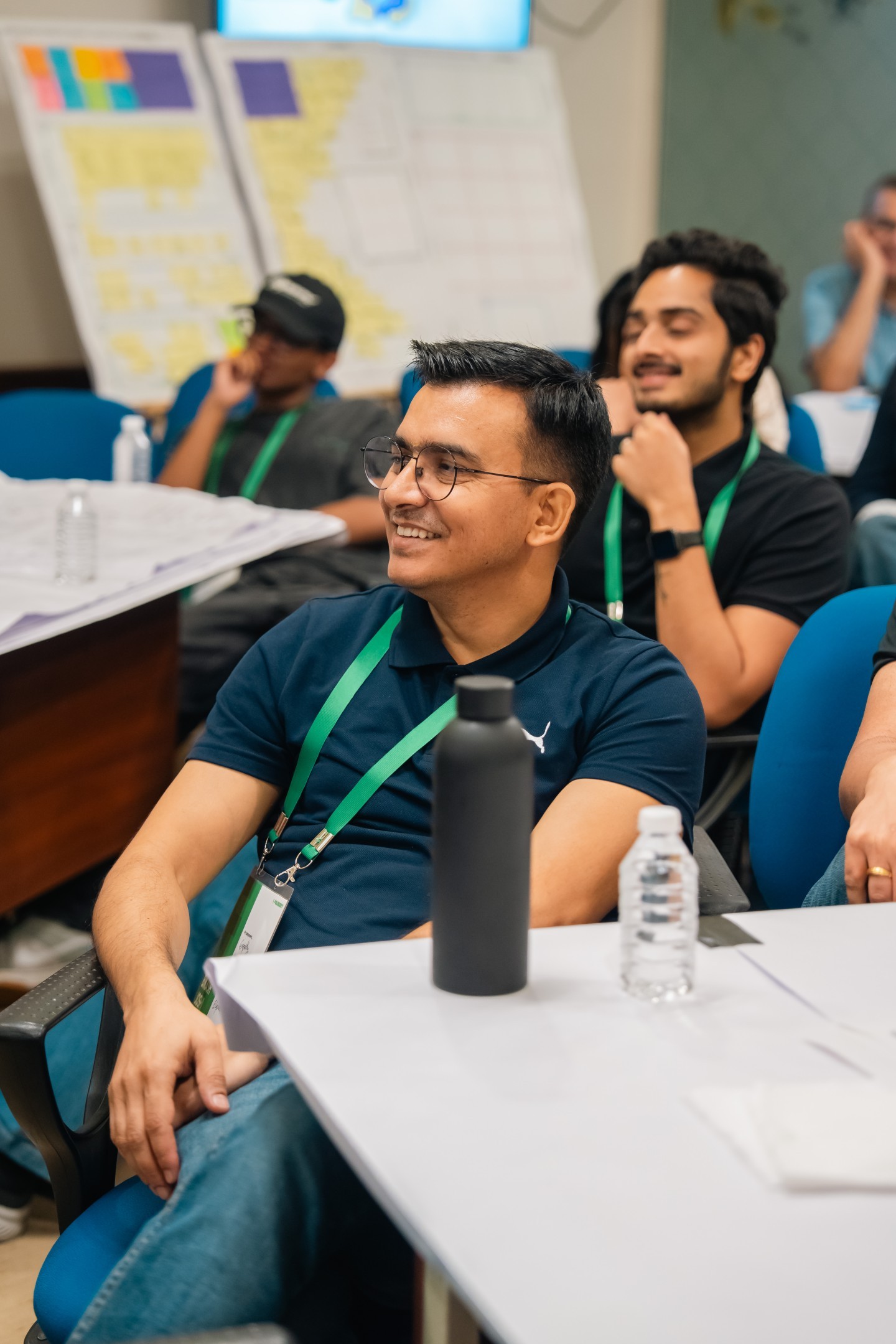 A mentee smiling during an in-person workshop